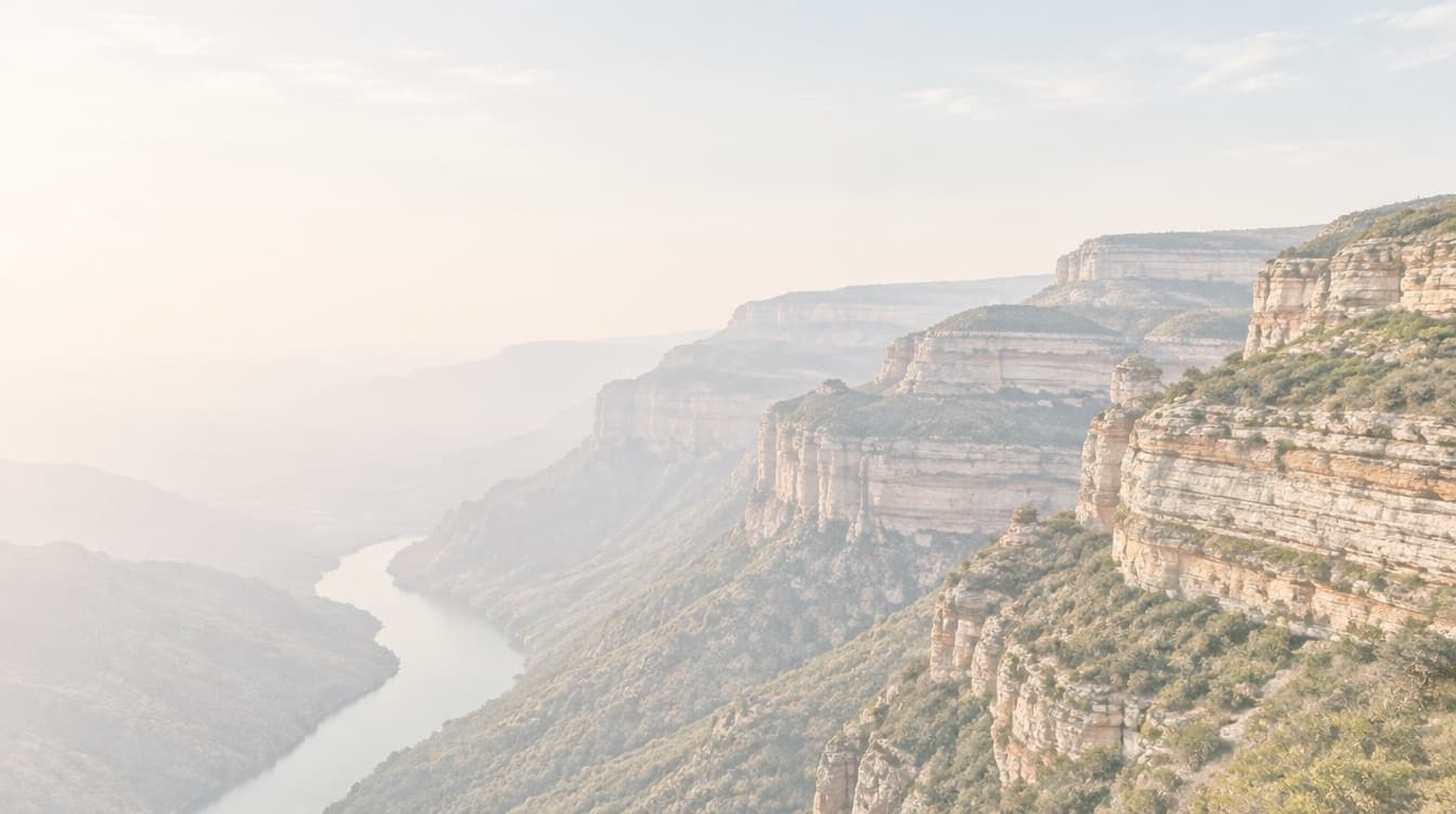Aerial view of a layered sandstone escarpment in high morning light